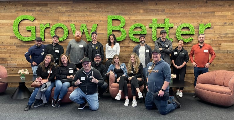 The Globalia team in front of the "Grow Better" sign in HubSpot HQ